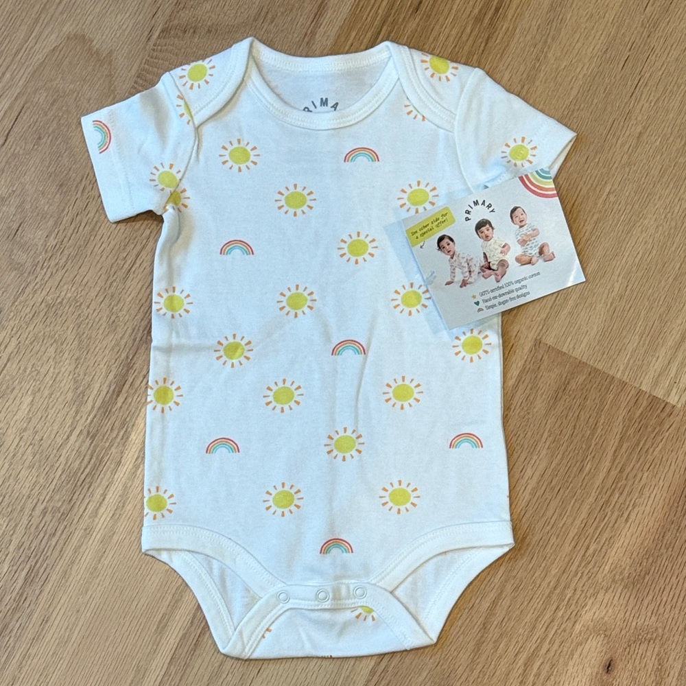 Primary White Bodysuit with Yellow Suns and Rainbow Print